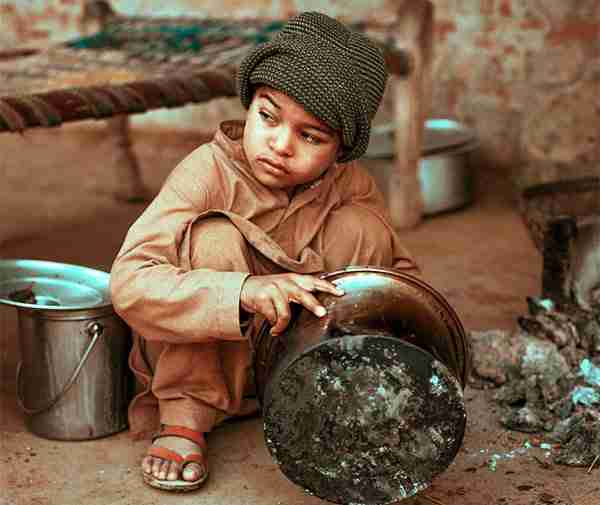 A child washes pots