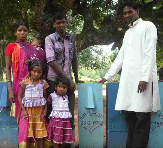 Family receives BioSand water filter from GFA World worker