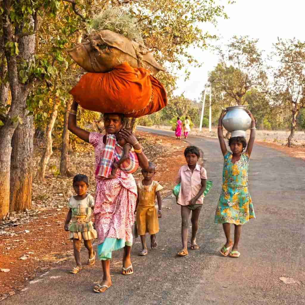 This mother and her five children are returning home from a ten-hour work day in the fields