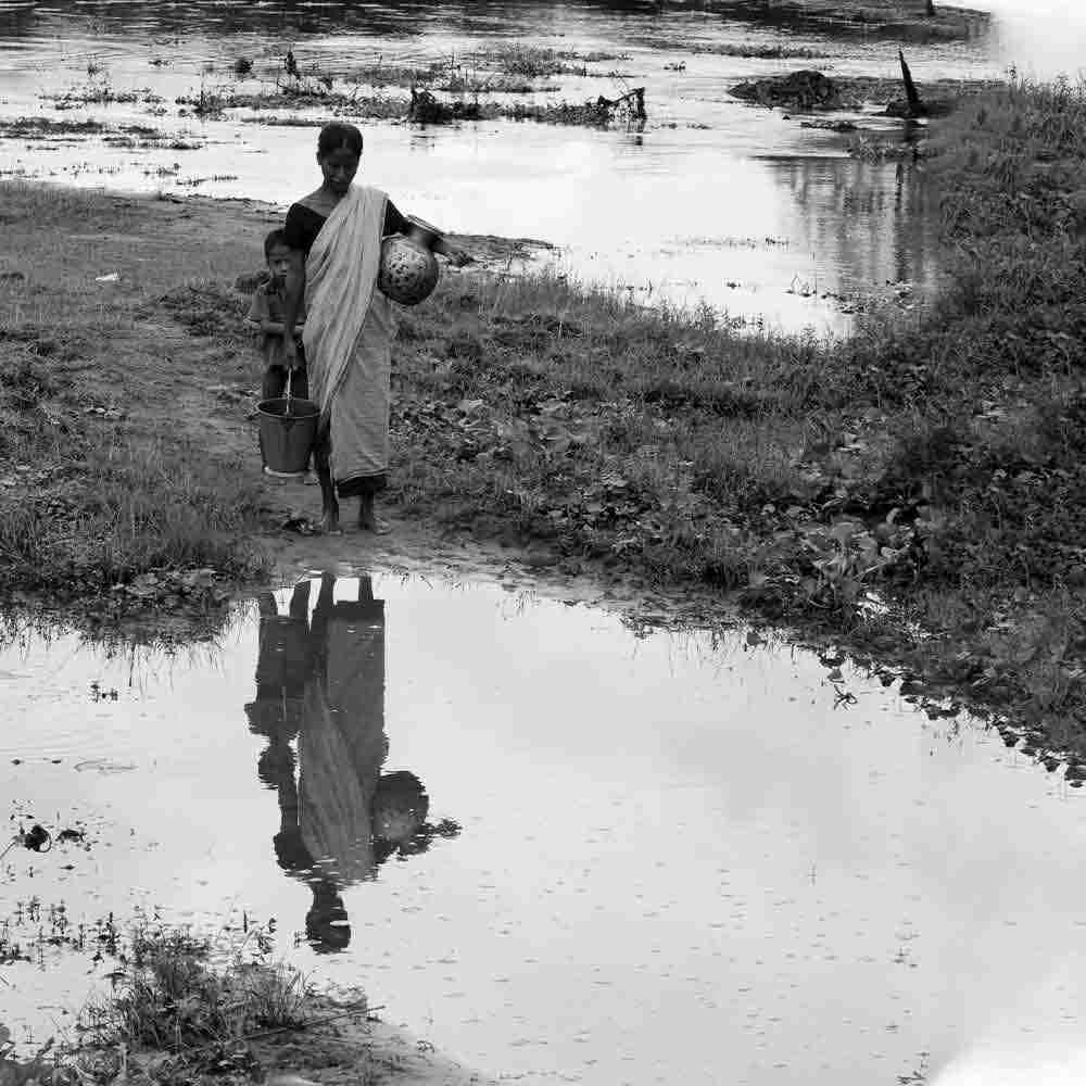 This woman and child would travel long distances to fetch water from this river everyday
