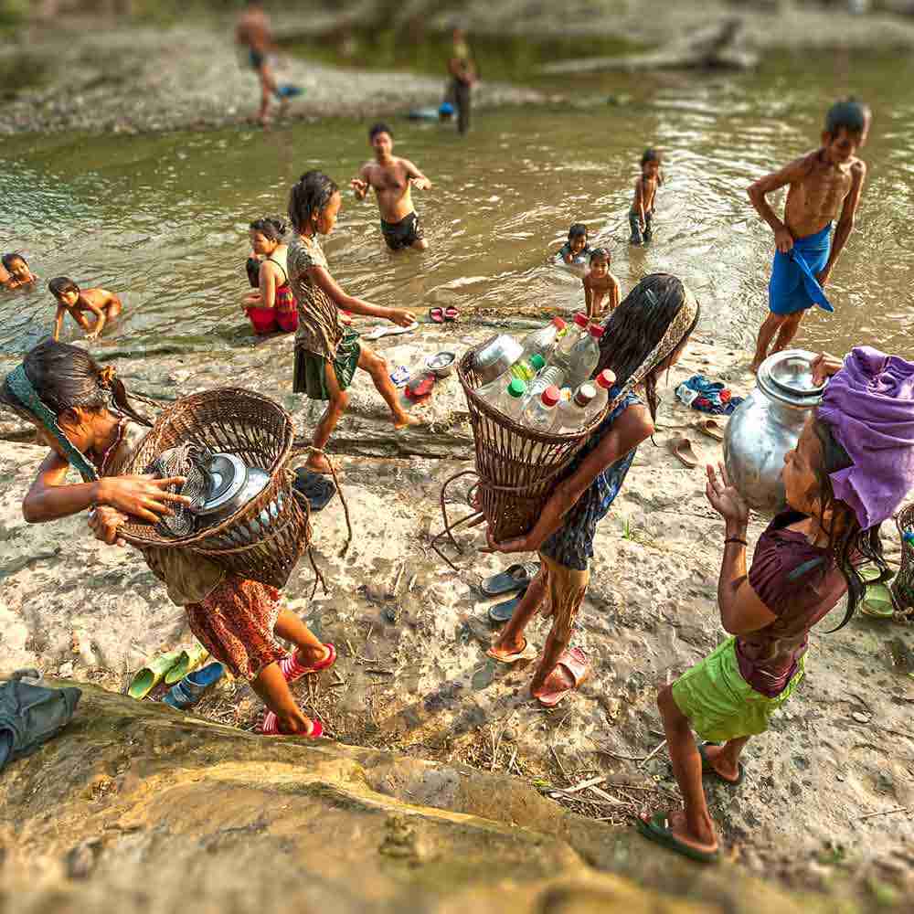 Children walked a kilometer to gather contaminated water from the river for their homes