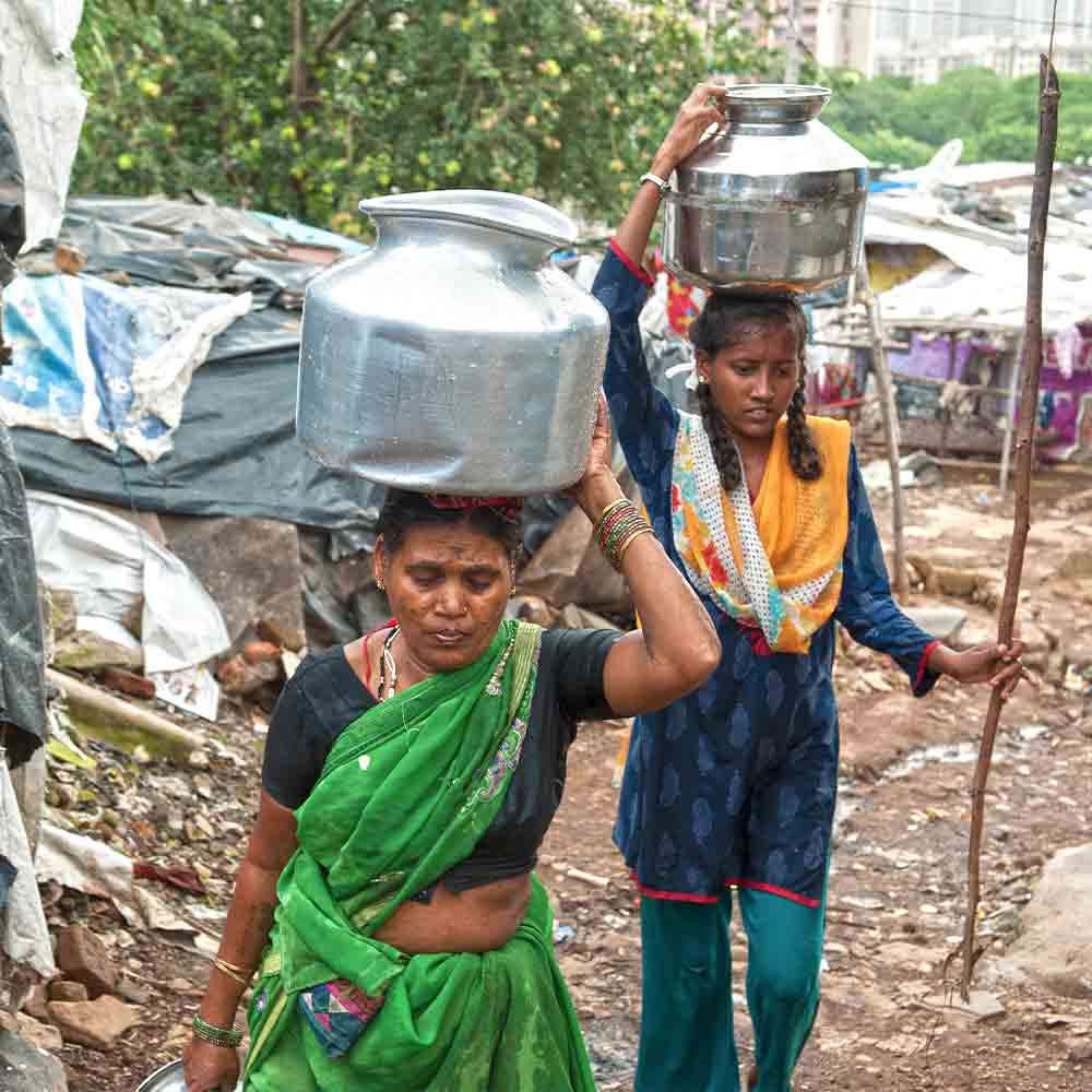 Finding good drinking water is a crisis the people in this slum face regularly. Because so little water is available to them, the slum dwellers have to walk extensively to fetch water.