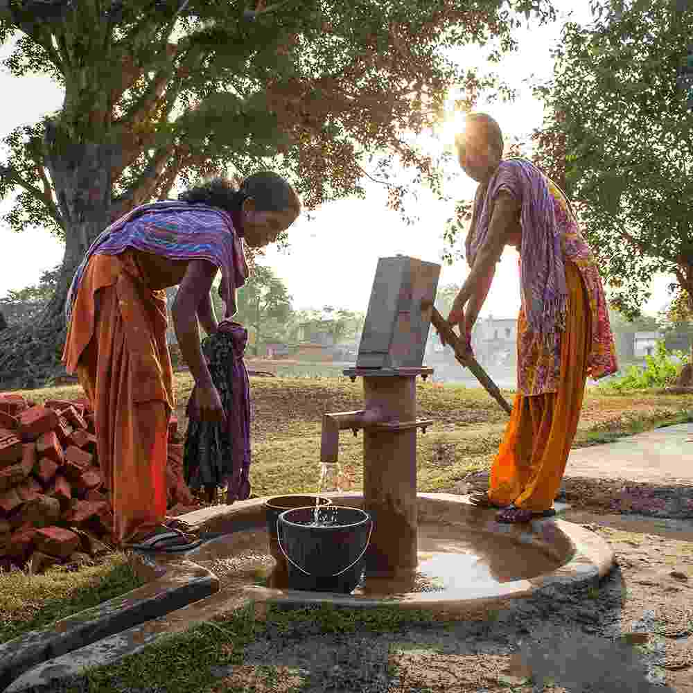 Women drawing clean water from GFA World Jesus Wells