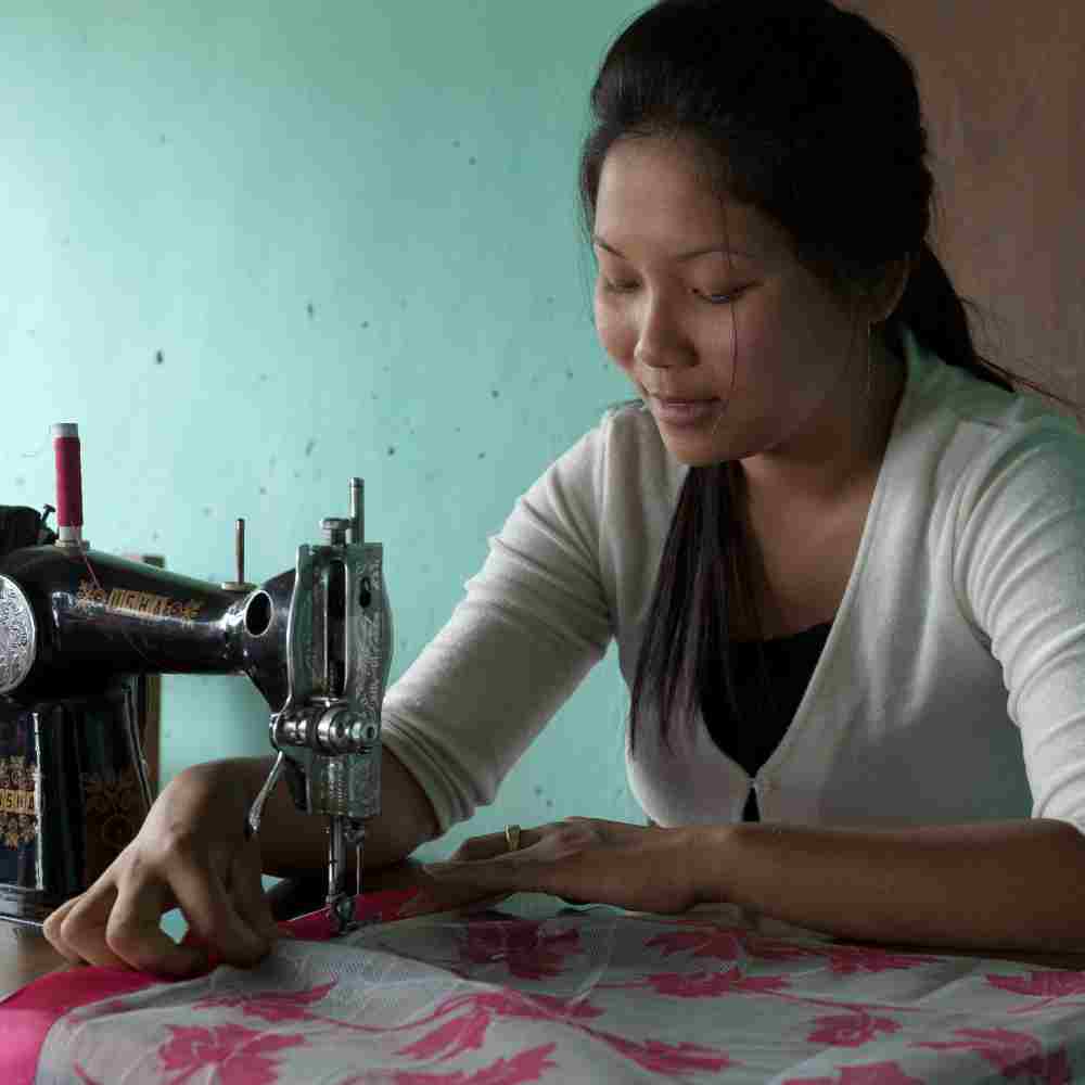 Like this woman, through the income generating gift of a sewing machine, Leena was provided a means to alleviate her family's poverty