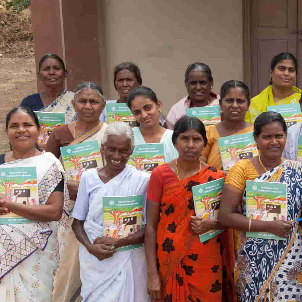 Women and their workbooks from GFA World adult literacy class