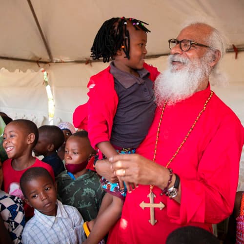 GFA World (Gospel for Asia) national missionaries sharing the love of Jesus to children with GFA World founder KP Yohannan
