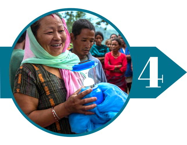 Woman form Nepal received relief supplies through GFA World compassion services disaster relief teams' supplies distribution