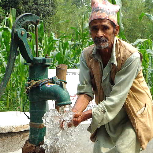 Elderly man enjoys clean water through GFA World Jesus Wells