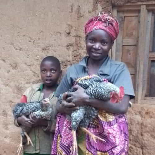 Family in Rwanda received a pair of chickens through GFA World Christmas Gift Catalog