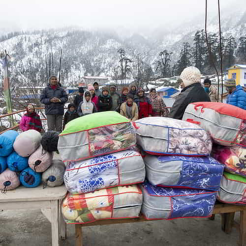 GFA World charitable Christmas gifts distribution of warm blankets to a village community