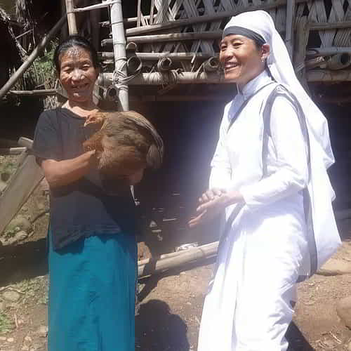 Mayra - a widow received a pair of chickens through GFA World Sisters of the Cross