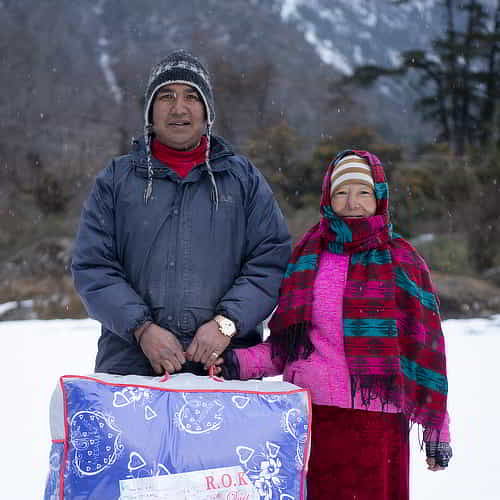 Recipients of warm blankets through GFA World Christmas gift distribution