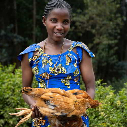 Woman received a pair of chickens through GFA World Christmas Gift Catalog