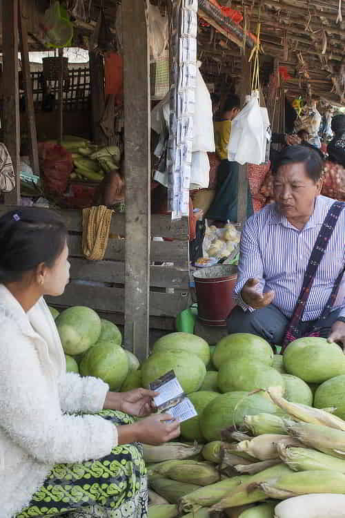 GFA World national missionary shares the message of God's love in a market in Asia