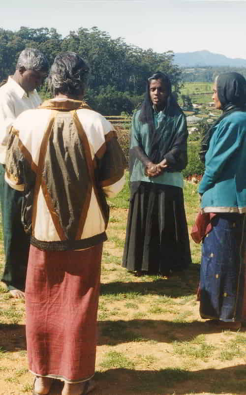 GFA World women missionary praying in the mission field