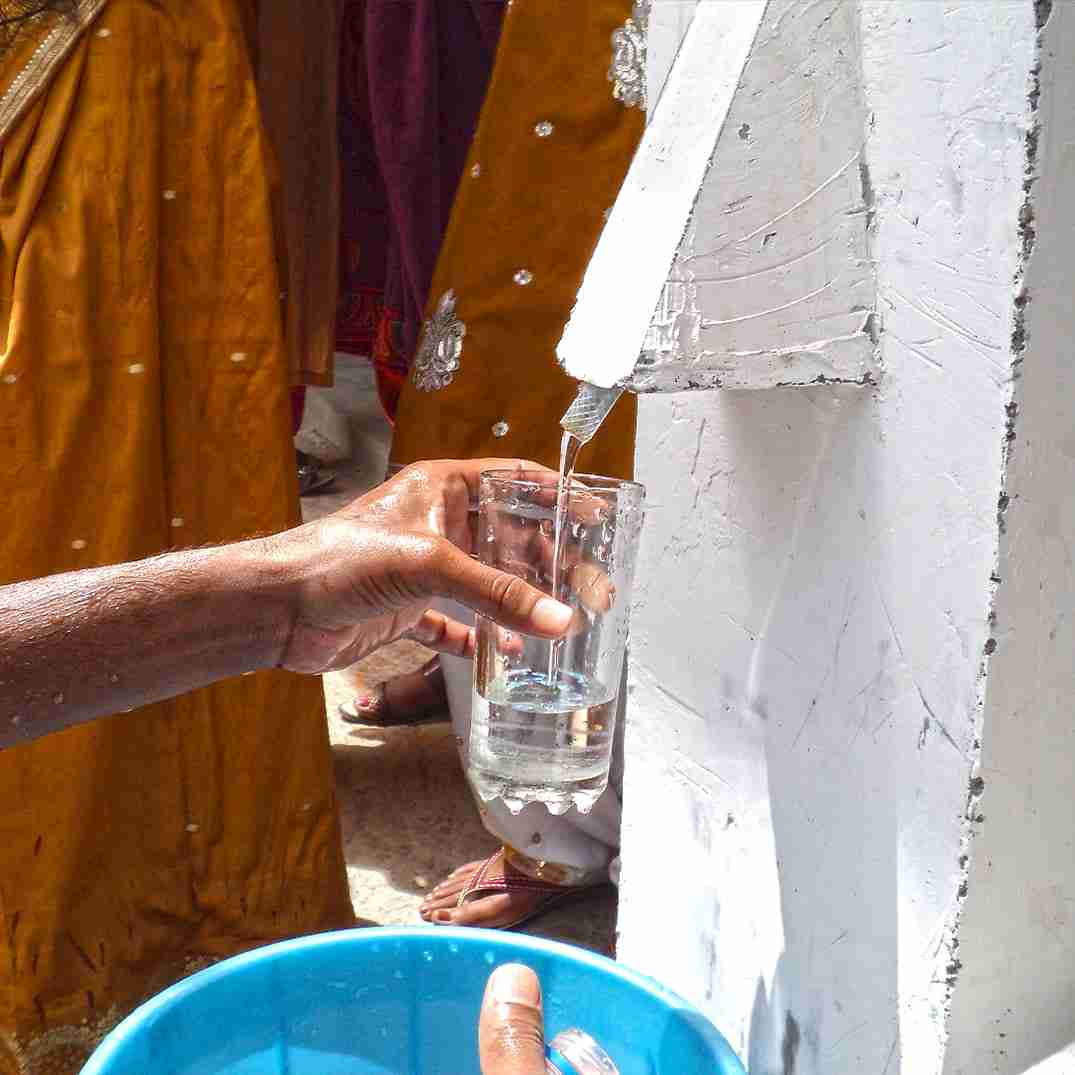 BioSand Water Filter fills up a glass with clean water