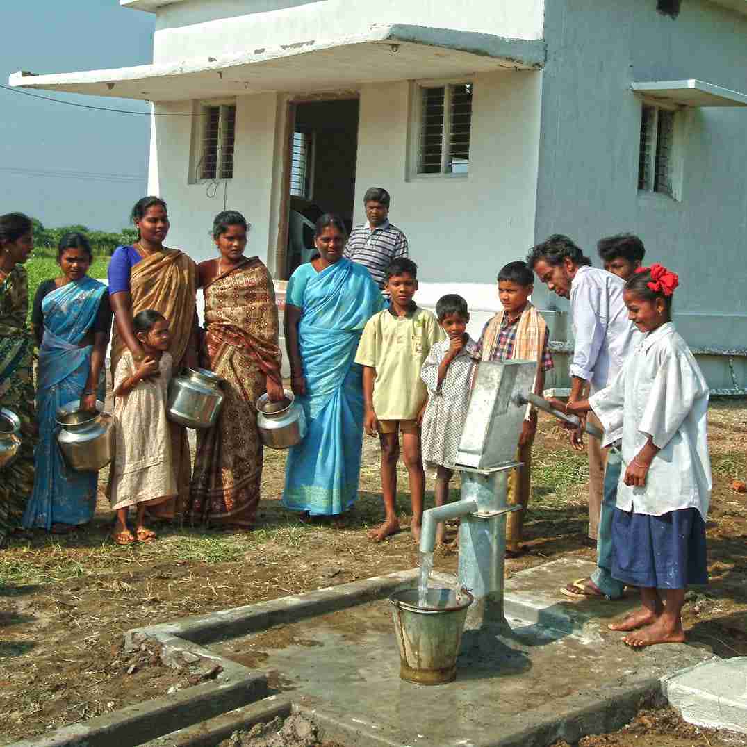Village drawing clean water from Jesus Well