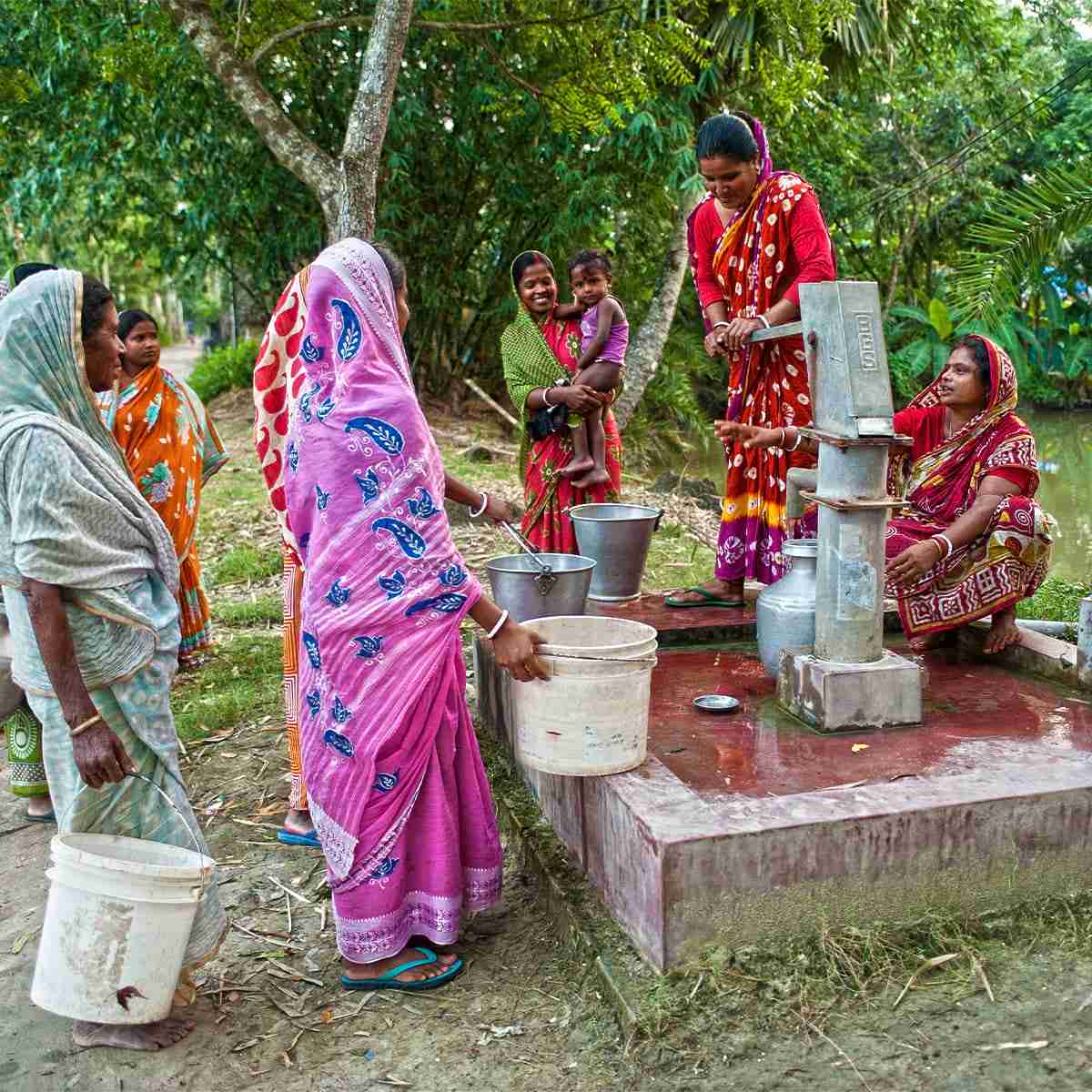 Group of women drawing clean water from GFA World provided Jesus Well