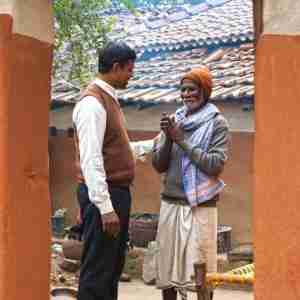 GFA missionary worker ministers to elderly leprosy patient