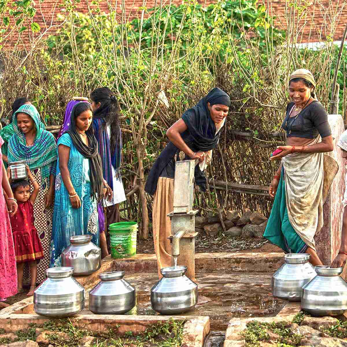 Group of women enjoying the benefits of clean water through Jesus Wells