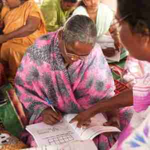 Woman learning basic math in GFA World literacy class