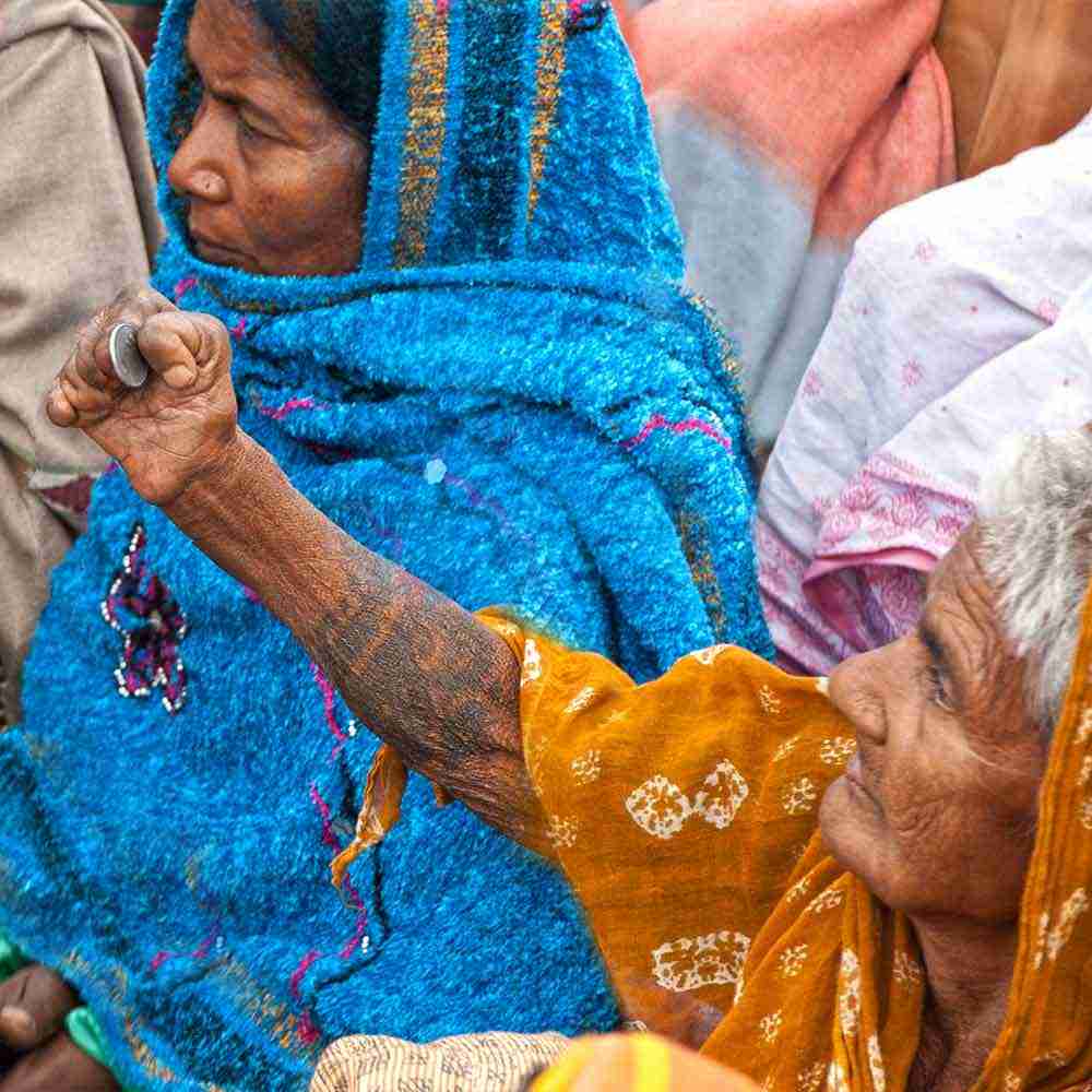 This woman gives a coin as an act of worship amid her poverty