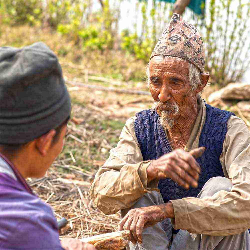 National missionary shares the message of God's love to elderly man.