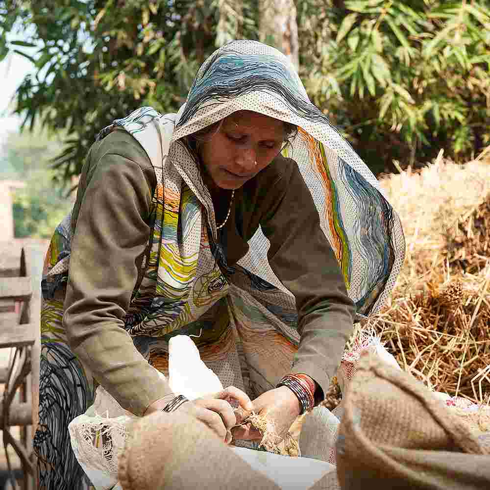 A woman in hard labor to provide for her family amid generational poverty