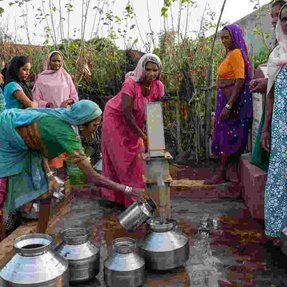 VIllage women drawing clean water from GFA World Jesus Wells