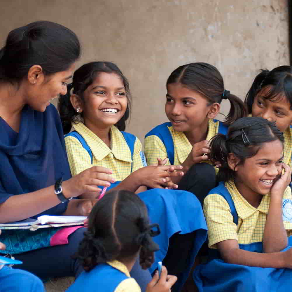 GFA World child sponsorship Bridge of Hope teacher interacting with girls