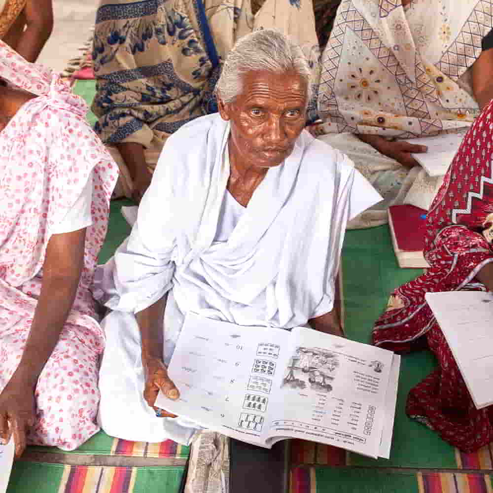 Elderly woman attending GFA World adult literacy class