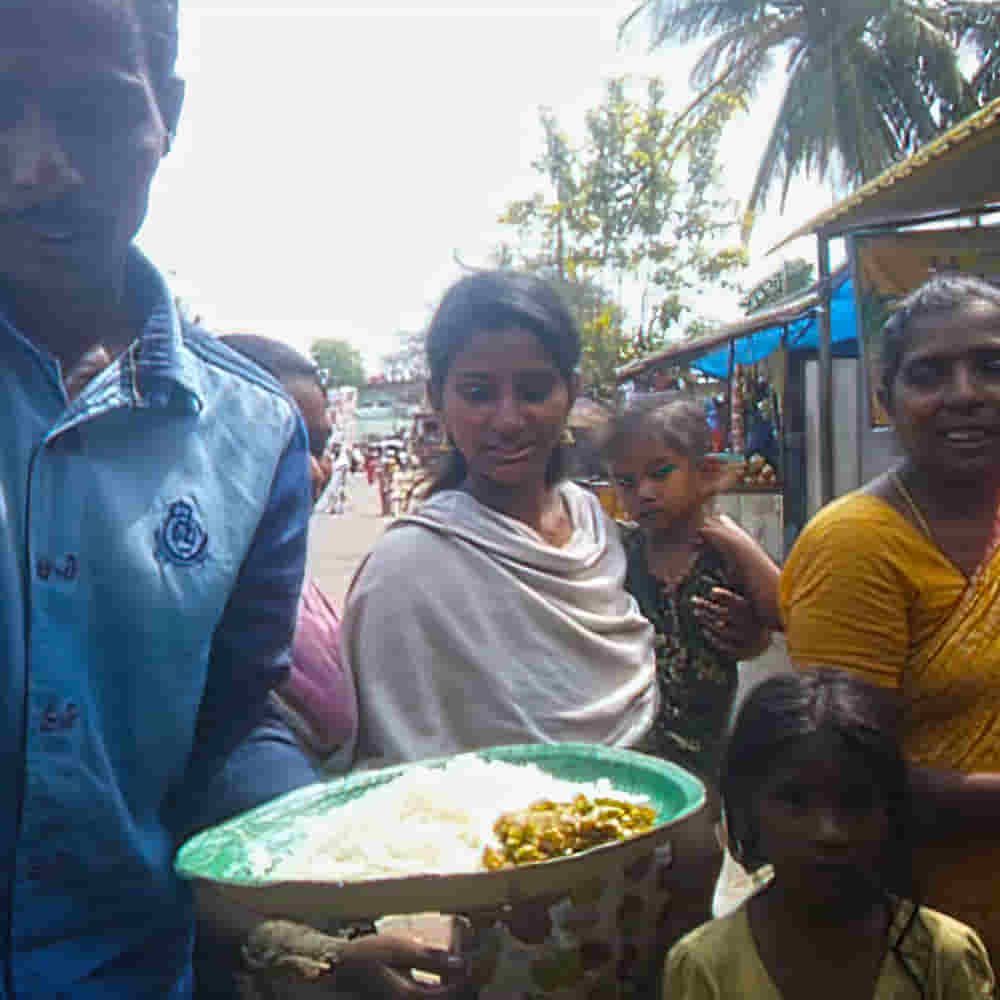 Feeding program for a village community in poverty in South Asia