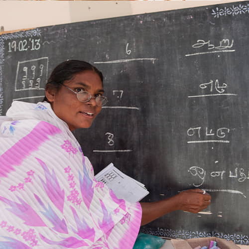GFA World woman missionary teaching an adult literacy class