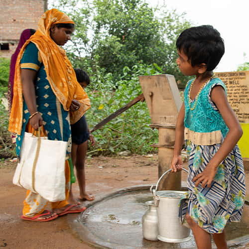 Mother and children enjoy clean water through GFA World Jesus Wells