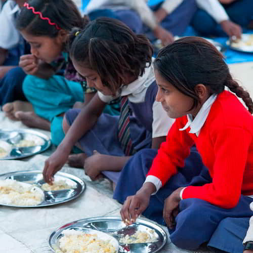 Children enjoy a nutritious meal everyday from GFA World (Gospel for Asia) child sponsorship program