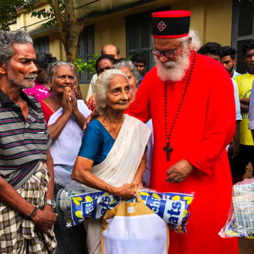 GFA World (Gospel for Asia) disaster relief teams and KP Yohannan distributing supplies to flood victims in South Asia