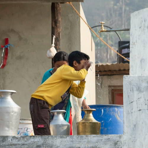 Young boy enjoys clean water through GFA World Jesus Wells