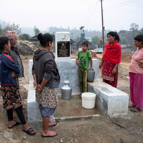 Women and children in this village in Nepal are collecting clean water through GFA World Jesus Wells