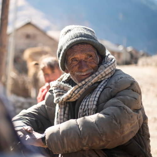 Elderly man from Nepal in poverty