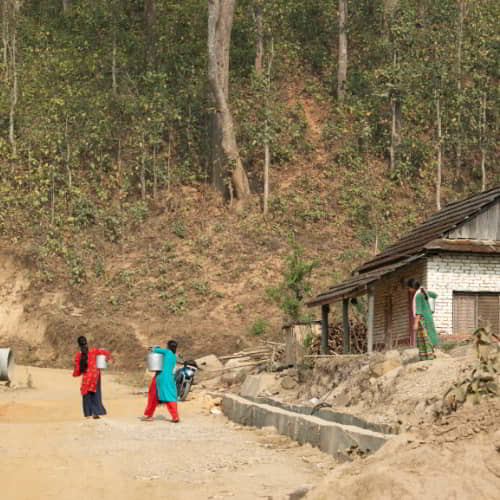 Women in Nepal walking long distances to collect water