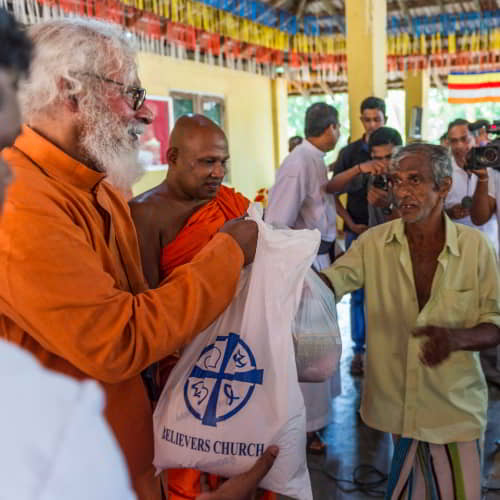 GFA World disaster relief teams and KP Yohannan distributing relief supplies