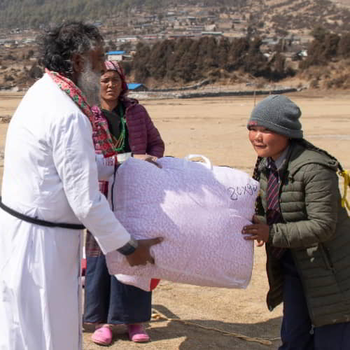 Young girl received a warm blanket from GFA World gift distribution