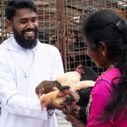 GFA World national missionary workers distribute income generating gifts of chickens
