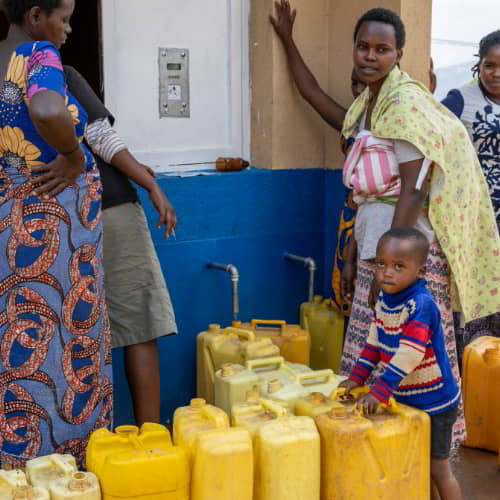 Family from Rwanda, Africa enjoys clean water through GFA World Jesus Wells