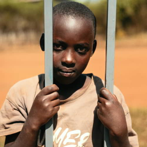 Young boy from Rwanda, Africa, living in poverty