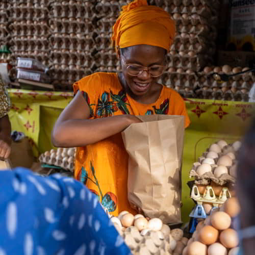 Woman from Rwanda working in a market stall